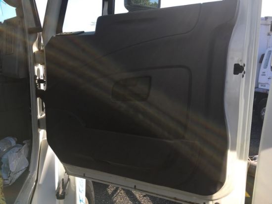Picture of 2011 International TranStar 8600. Passenger side gray plastic interior door panel.  