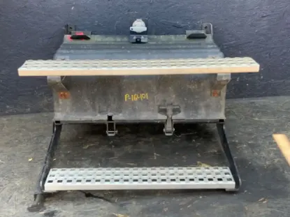 Picture of (Used) 2018 Volvo VNL, BATTERY BOX, 
Side: Driver Side,
Color: Black,
Capacity: 4 batteries,
Material: Steel with plastic cover 
Dimensions: L=30.5”, W=15”,
Reference images for condition 
 


